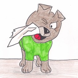 Little Cairn Terrier chews a piece of paper.