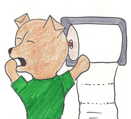 Cairn terrier puppy wearing green sweater yawns as he plays with boring toilet paper.