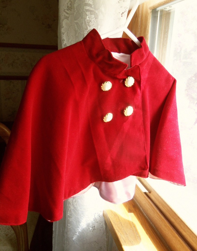 Red velveteen capelet for little girls.