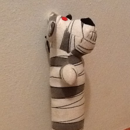 Side view of mummy Loofah dog toy