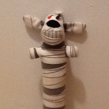 Mumy Loofah dog poses for mug shot.