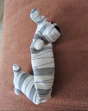 Unstuffed mummy loofah dog.