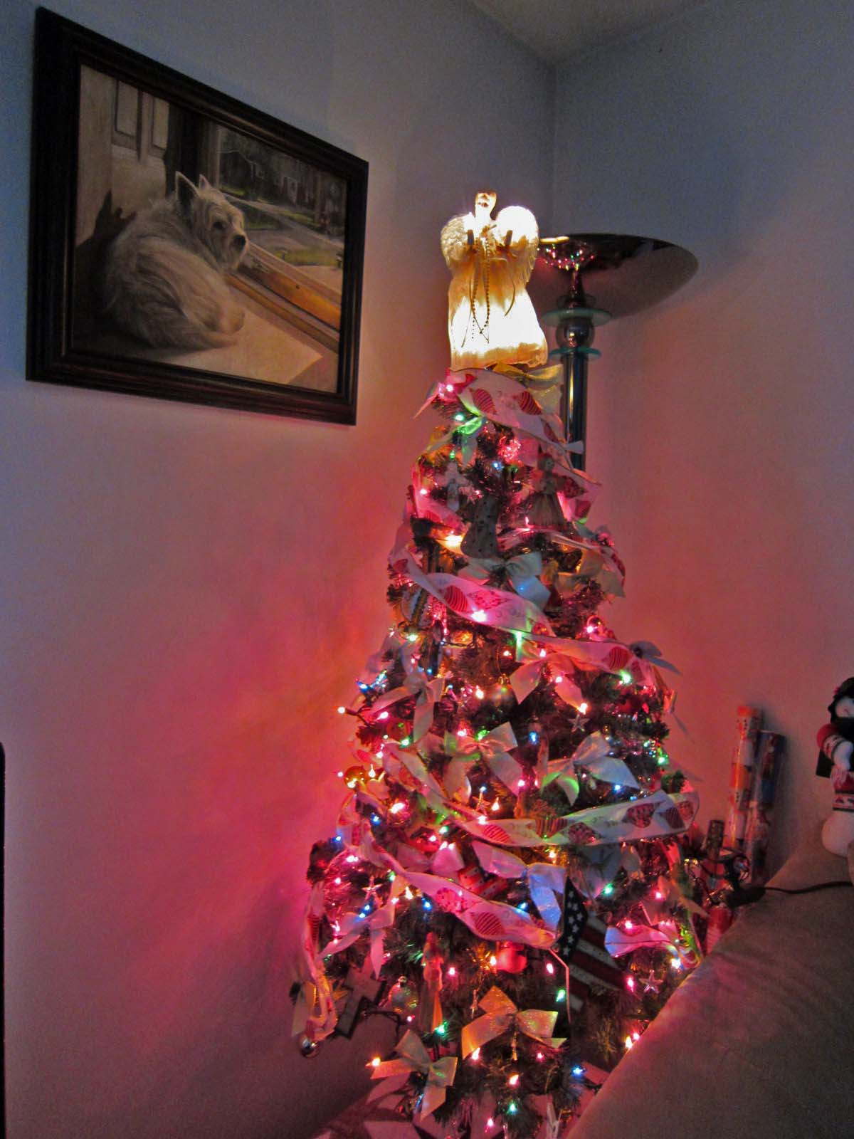 Christmas tree with picture of Geordie overlooking the scene.