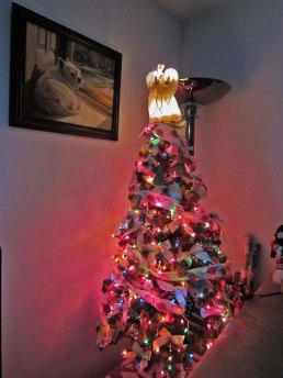 Christmas tree with picture of Geordie overlooking the scene.