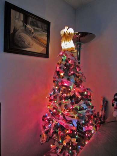 Christmas tree with picture of Geordie overlooking the scene.
