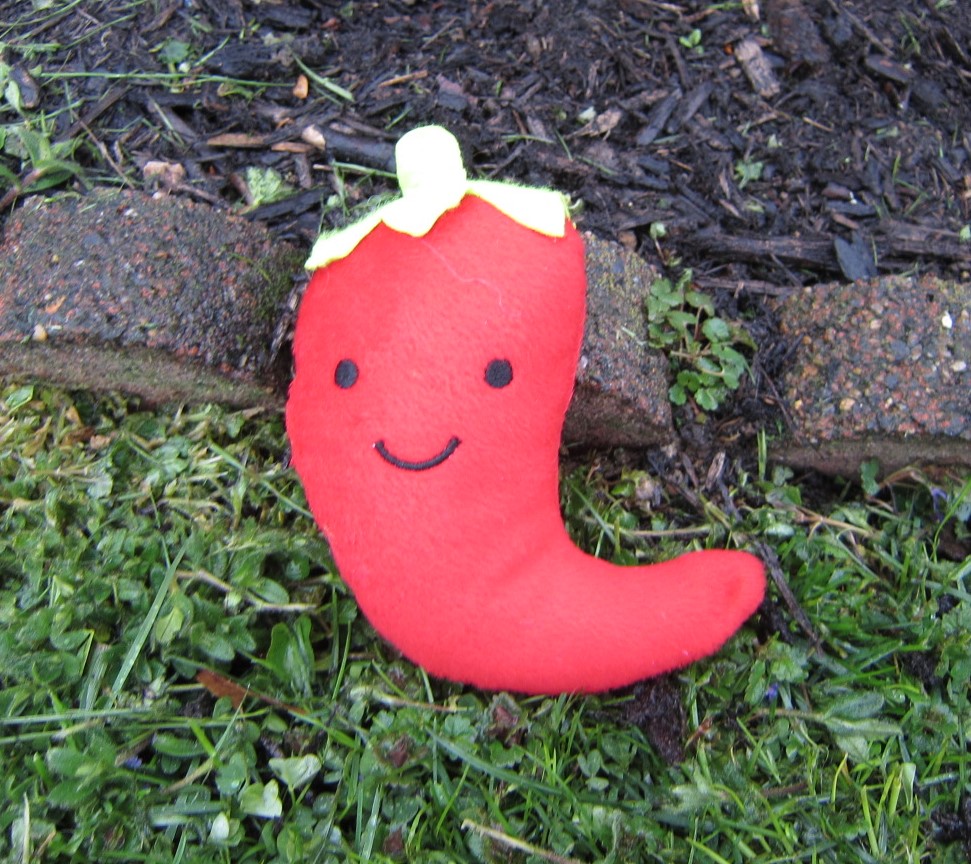 Smiling chili pepper toy.