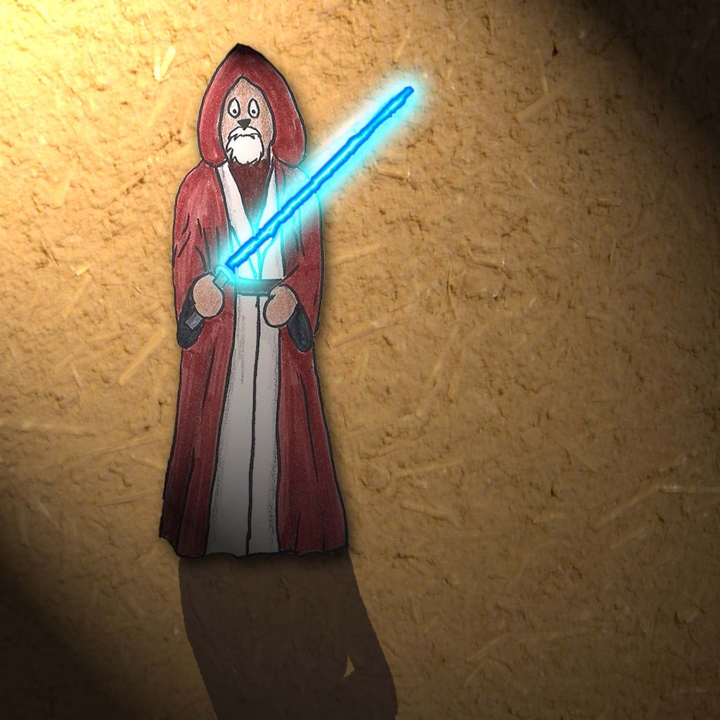 Toby Wan stands with his light saber.