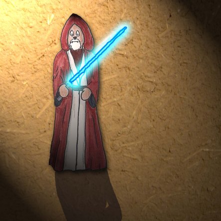 Toby Wan stands with his light saber.